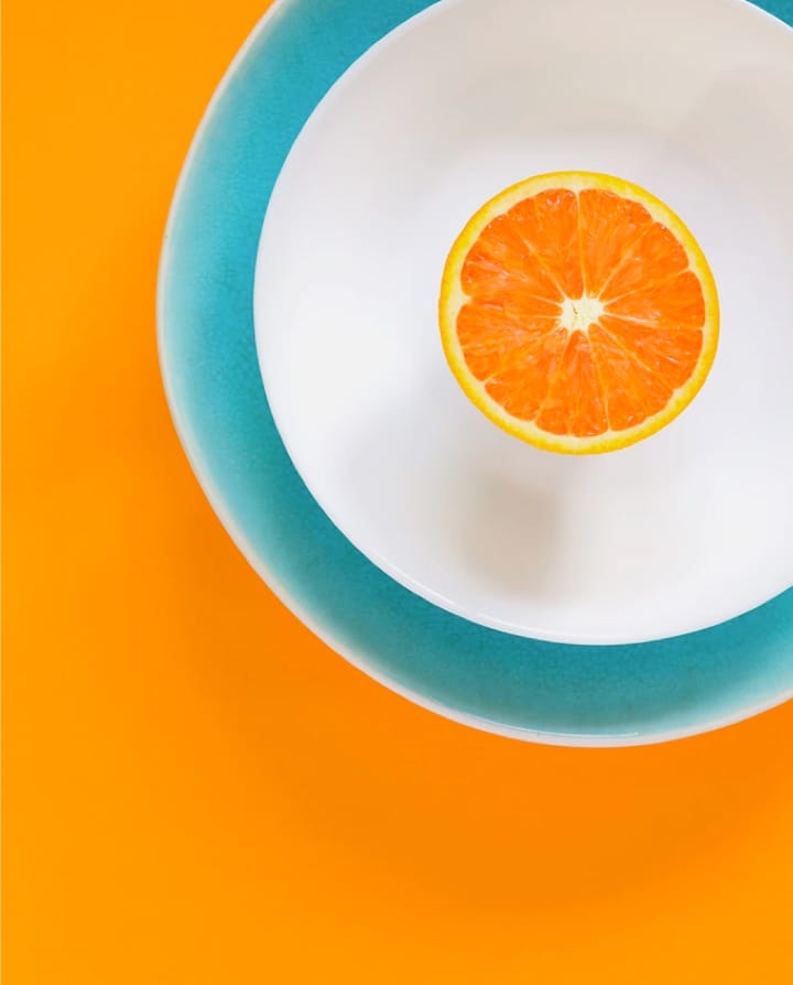 half orange in round plate