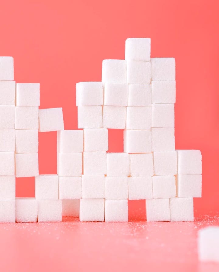 a lot of sugar cubes stacked on top of each other