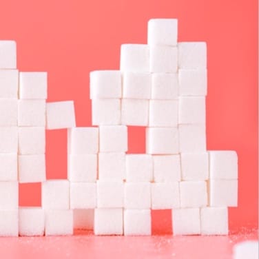 a lot of sugar cubes stacked on top of each other